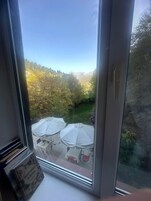 Basic Triple Room, Garden View | Desk, laptop workspace, iron/ironing board, free WiFi