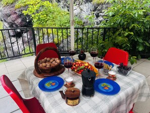 A table set outdoors with a view of greenery and a railing. - Noor Dilijan (Dilijan)