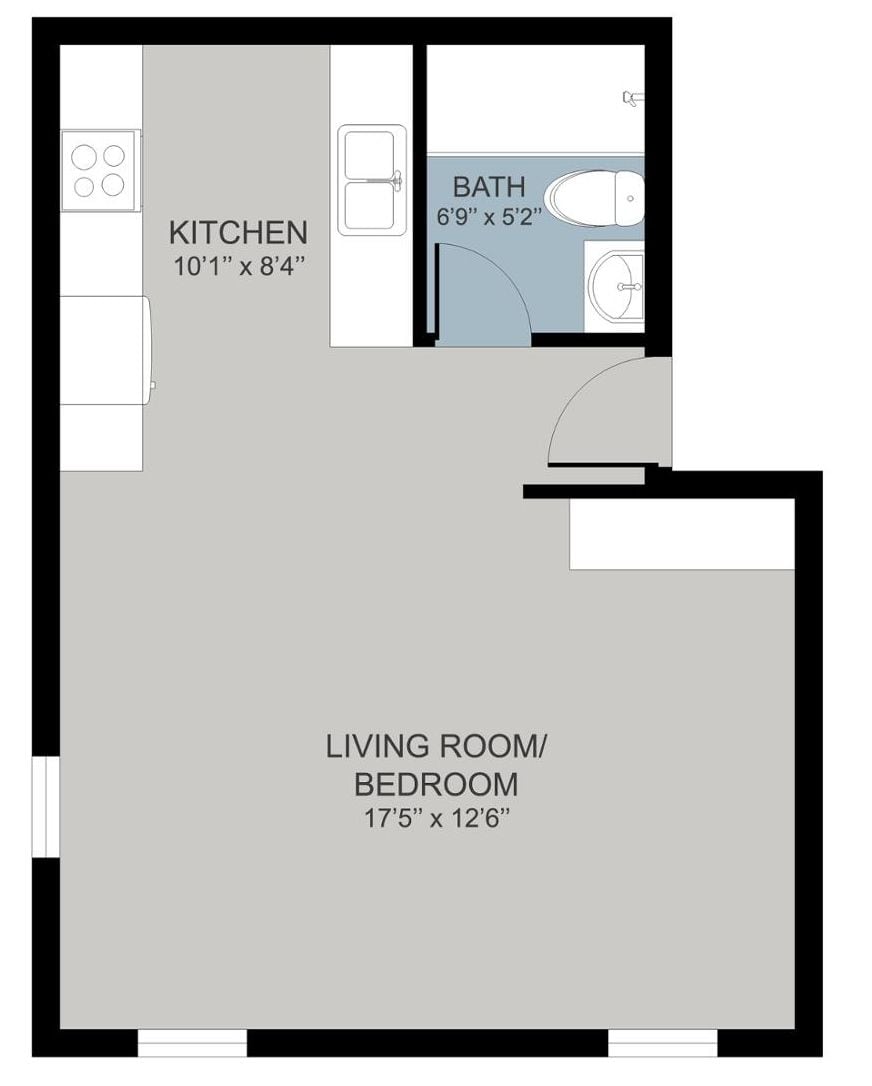 Plànol d'una cuina que fa 3,05 metres per 2,54 metres, un bany que fa 2,06 metres per 1,57 metres, i un saló/dormitori que fa 5,26 metres per 3,78 metres.