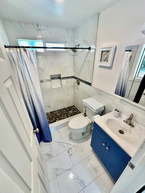 Shower, hair dryer, towels, soap