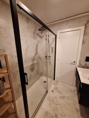 Shower, hair dryer, towels, soap
