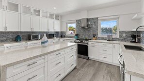 Oven, stovetop, coffee/tea maker, cookware/dishes/utensils