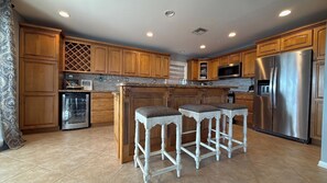 Fridge, stovetop, coffee/tea maker, cookware/dishes/utensils