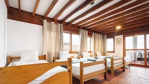 Classic Quadruple Room, Sea View | WiFi (free), bed sheets - El Templo Surf House (Punta Hermosa)
