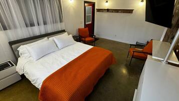Suite monolocale Comfort, letti multipli, non fumatori, angolo cottura | Una cassaforte in camera, tende oscuranti, Wi-Fi gratuito