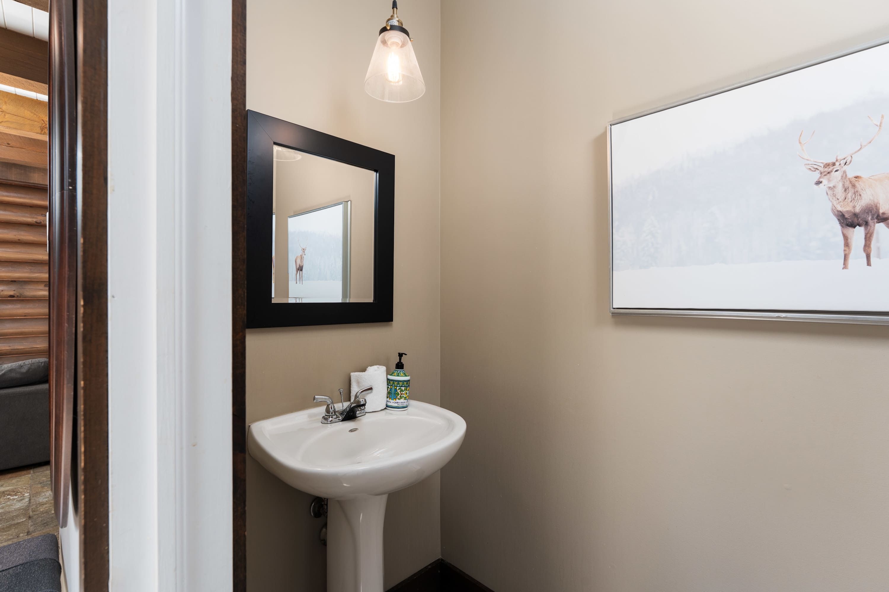 The main floor powder room is easily accessible off the main living room. 