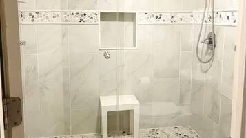 Shower, hair dryer, towels, soap