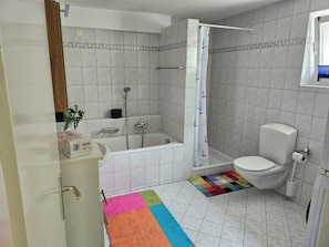 Shower, hair dryer, towels, toilet paper