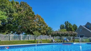 A swimming pool with a white fence and trees in the background. - Must see 4/3 Family/Pet Friendly+Pool&hot tub (Galax)