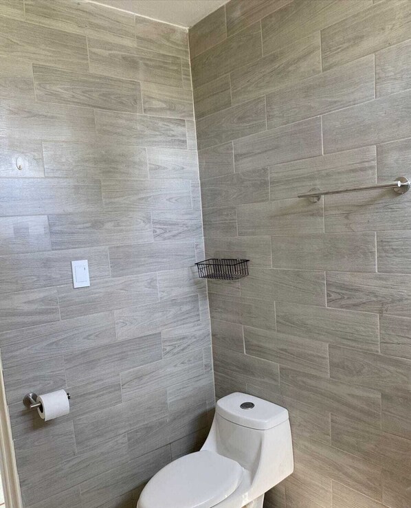 Shower, towels, soap, toilet paper