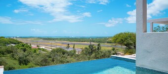 Affordable luxury, with runway views and tropical breeze.