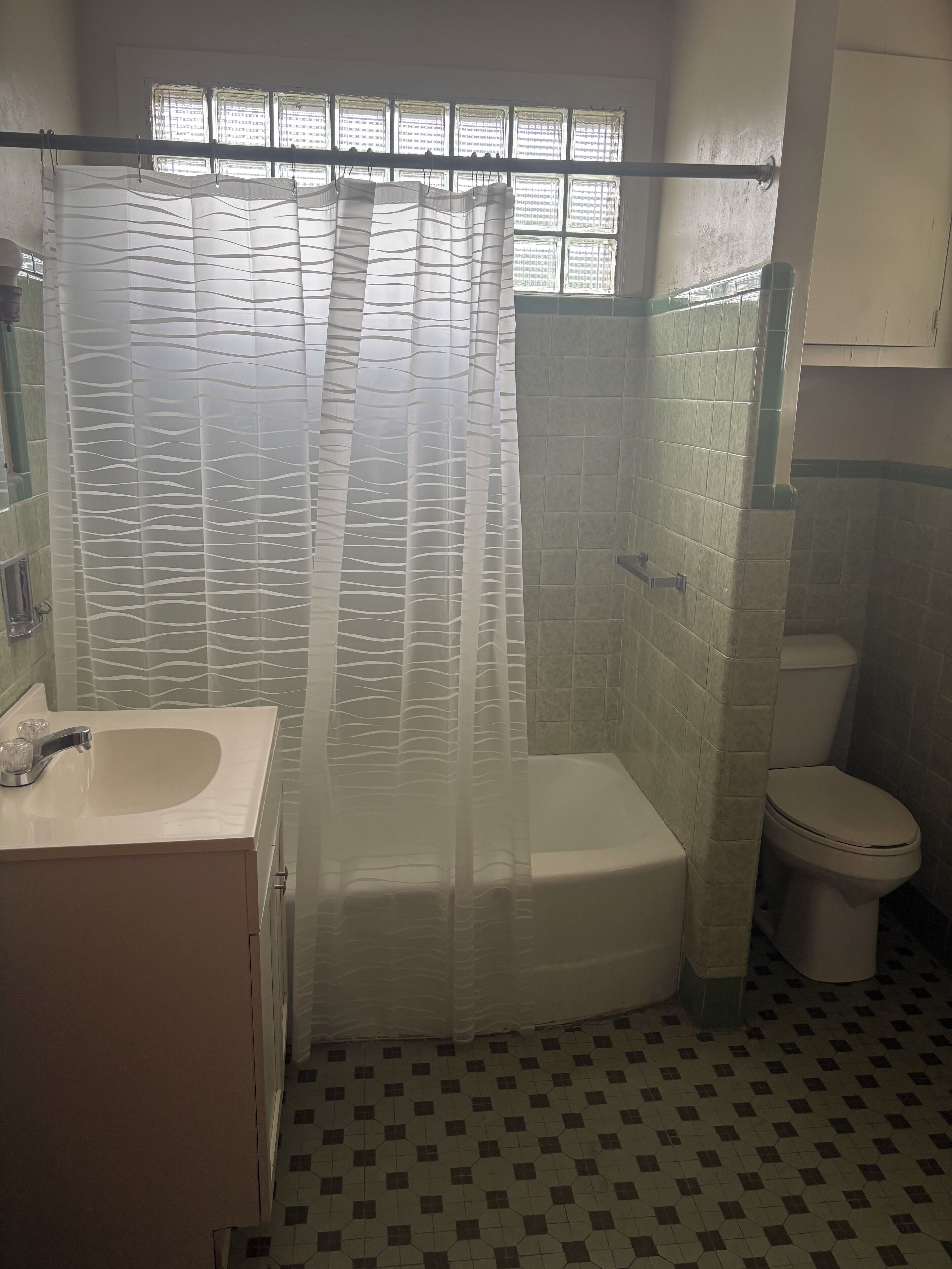 Shower, hair dryer, towels, toilet paper