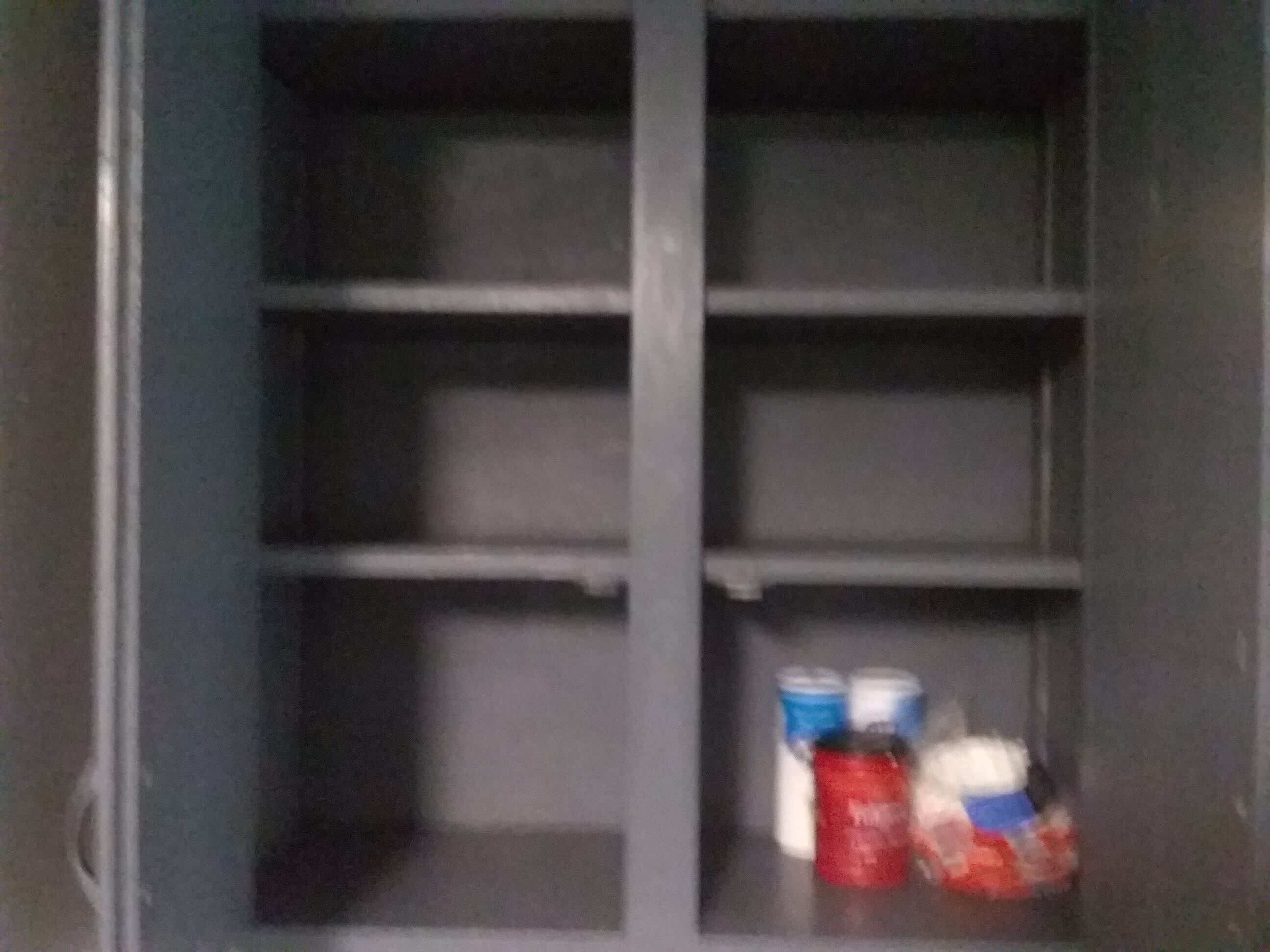 A dark-colored cabinet with multiple shelves.