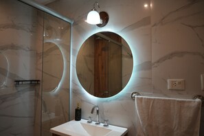 Shower, hair dryer, towels, toilet paper