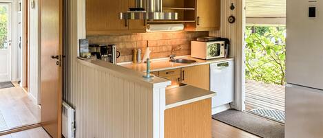 Fridge, stovetop, dishwasher, coffee/tea maker