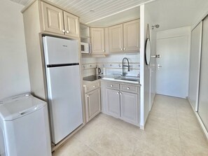 Fridge, microwave, cookware/dishes/utensils