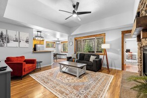 Smart TV, fireplace, books, computer monitors