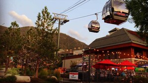 A building with outdoor seating and a sign for a restaurant. - 2 bed, 2 bath luxury condo at Marriott's Grand Residence in South Lake Tahoe. (South Lake Tahoe)