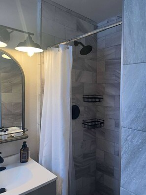 Shower, towels, soap, toilet paper