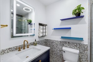 Shower, hair dryer, towels, soap