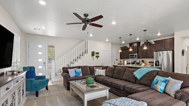 A modern living room with a sectional sofa, a coffee table, and a television. - Above Parr - Pet Friendly New Listing (Washington)