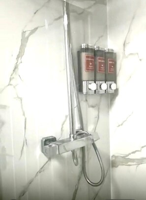 Shower, hair dryer, towels, soap