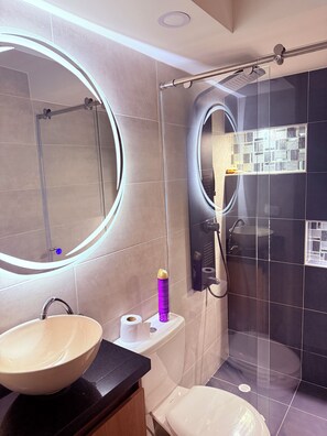 Shower, towels, soap, toilet paper