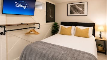 1 bedroom, desk, iron/ironing board, travel crib