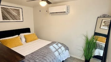 1 bedroom, desk, iron/ironing board, travel crib