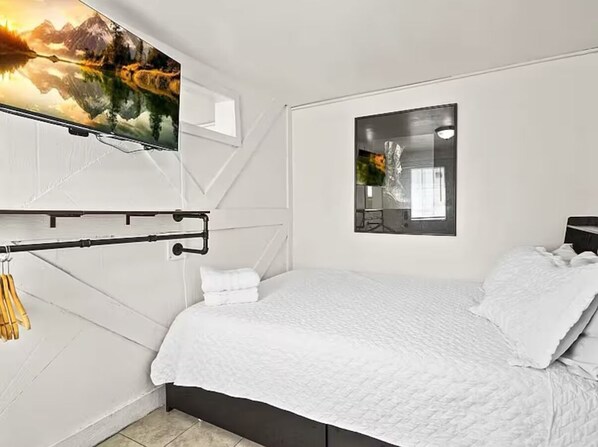 1 bedroom, desk, iron/ironing board, travel crib