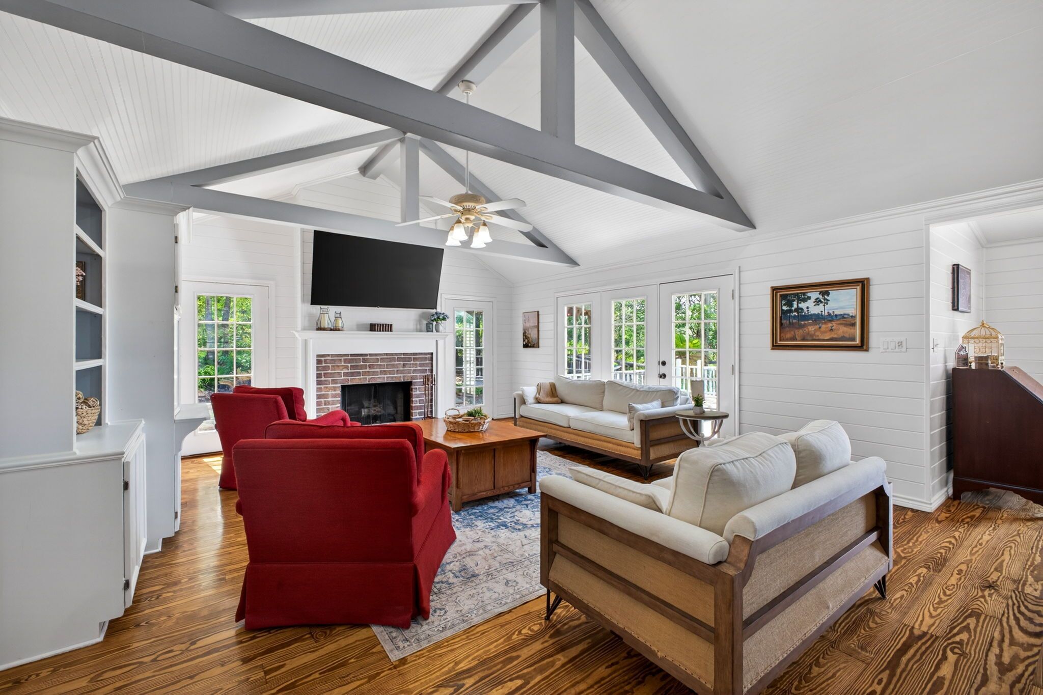 Smart TV, fireplace, books, printers