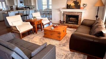 Smart TV, fireplace, books, printers