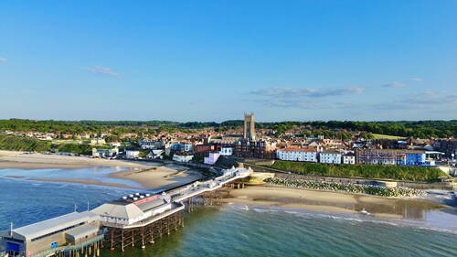 Little Manor House boasts grand rooms and tall ceilings in this imposing Victorian House in the hear