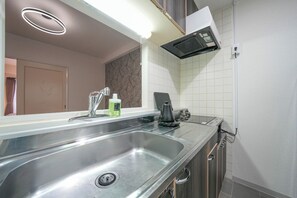 Fridge, microwave, cookware/dishes/utensils