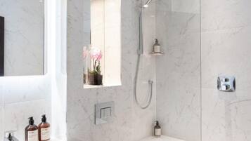 Shower, hair dryer, towels, soap