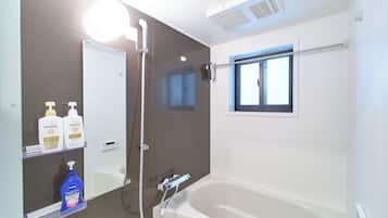Combined shower/tub, hair dryer, slippers, towels
