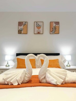 1 habitación, tabla de planchar con plancha y cuna de viaje 