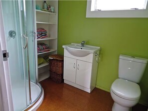 Shower, eco-friendly toiletries, towels, toilet paper