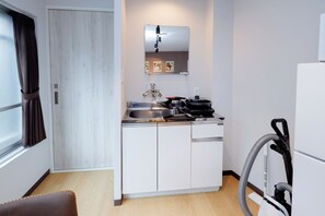 Apartment | Private kitchen | Fridge, microwave, stovetop, cookware/dishes/utensils