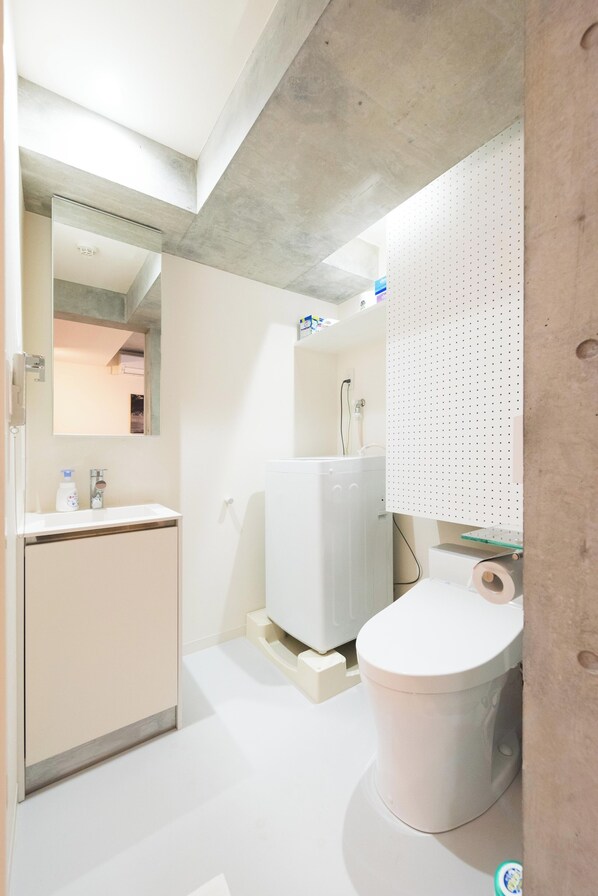 Hair dryer, bidet, towels, soap
