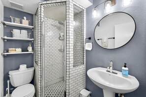 Shower, hair dryer, towels, soap