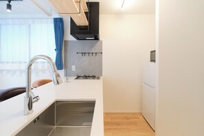 Fridge, microwave, stovetop, cookware/dishes/utensils