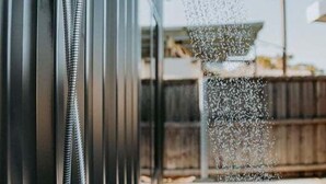 A showerhead with water flowing from it, attached to a wall. - Bichenobae, where coastal cool meets comfort and fun (Bicheno)