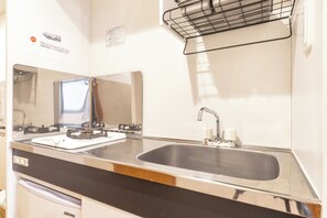 Full-sized fridge, microwave, stovetop, cookware/dishes/utensils