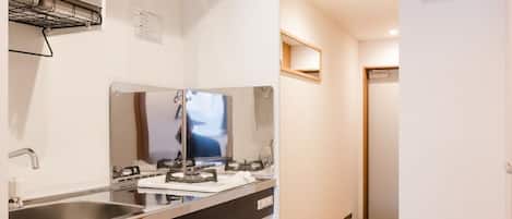 Modern Elegance in Shinjuku Gyoenmae | Private kitchen | Full-size fridge, microwave, stovetop, cookware/dishes/utensils