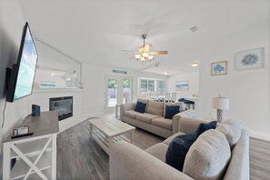 Signature House, 3 Bedrooms, Non Smoking, Patio | Living room | 55-inch Smart TV with digital channels, fireplace - Tranquil Haven | Pet Friendly (Pensacola)