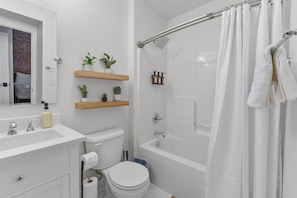 Shower, hair dryer, towels, shampoo
