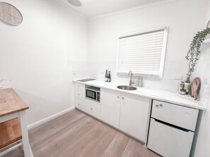 Fridge, microwave, stovetop, coffee/tea maker