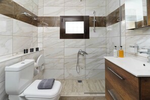 Deluxe Studio, Multiple Beds, Balcony, City View | Bathroom | Free toiletries, slippers, towels, soap