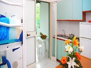 Fridge, stovetop, cookware/dishes/utensils